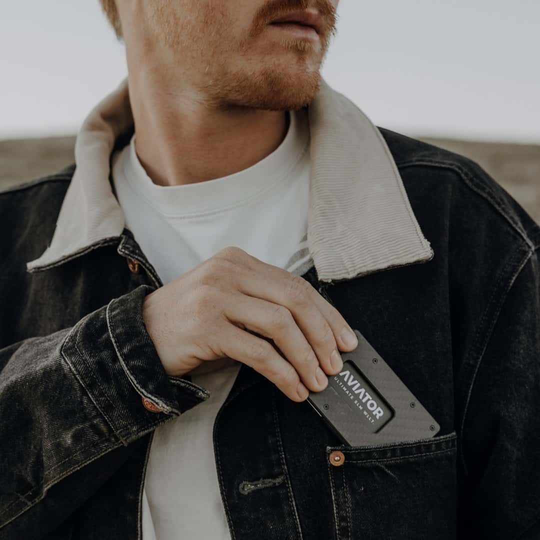 pulling out an aviator wallet front front pocket