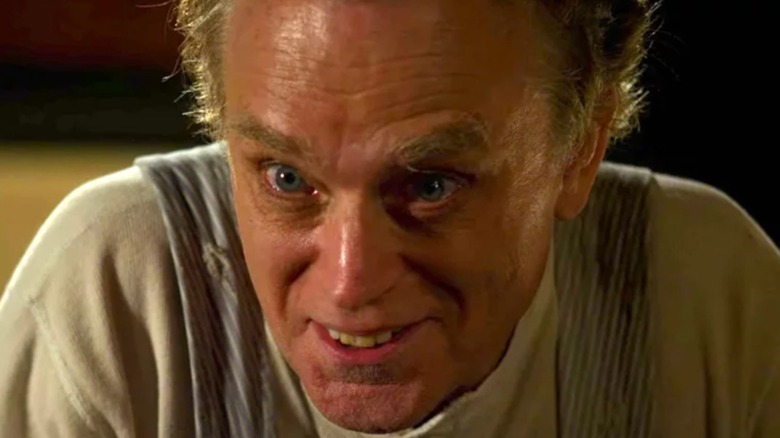 Brad Dourif's Adam Rain grins, eyes wide, in Criminal Minds