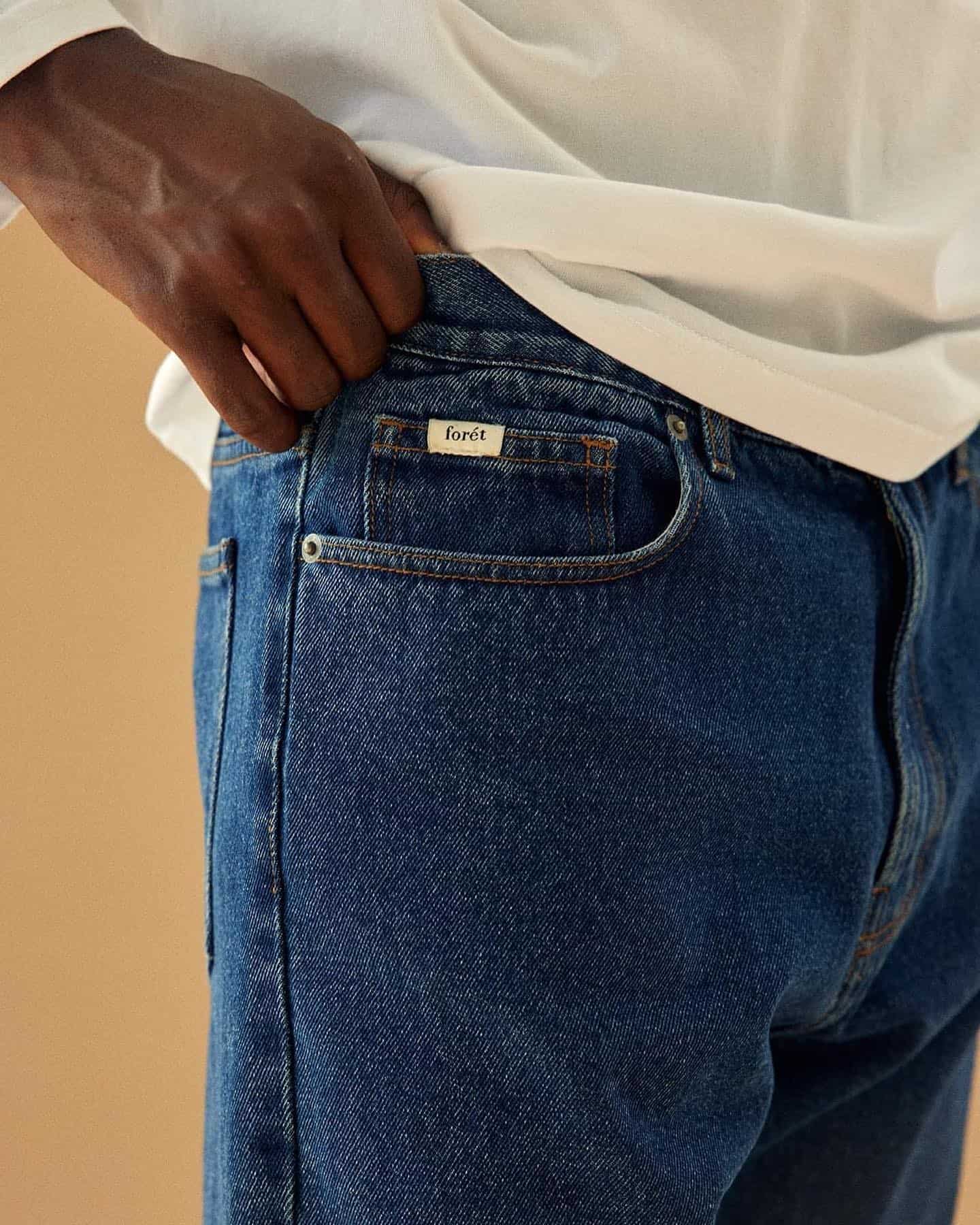 man pulling up his jeans