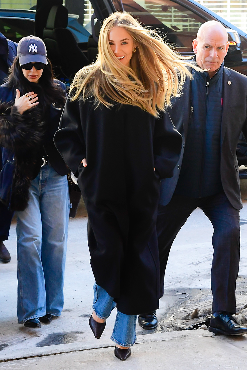 Michelle Randolph wearing a black coat, jeans, and pumps in NYC