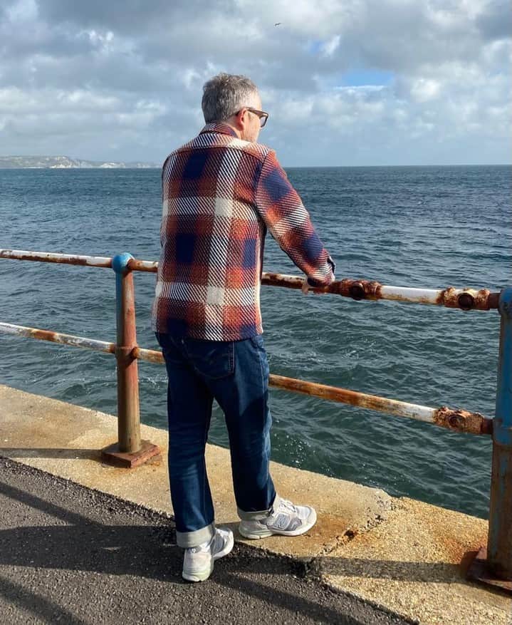 man looking far out the sea